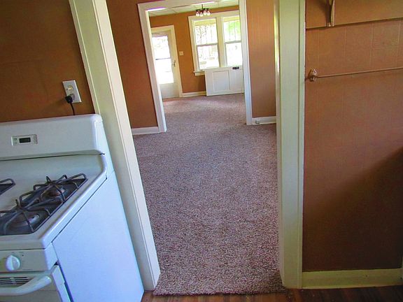 from kitchen into dining room and living room