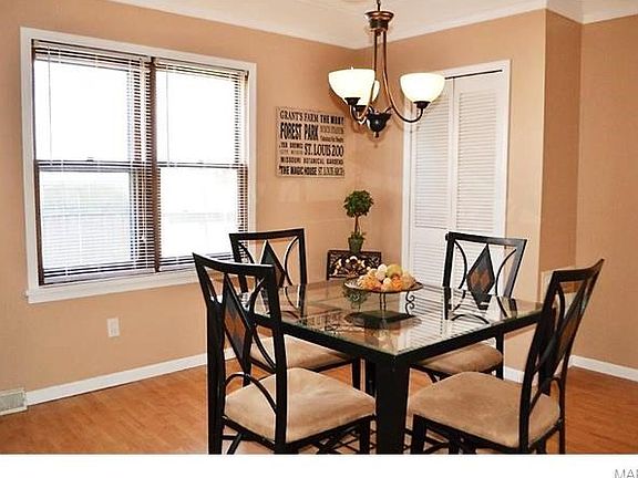 Separate Dining Room with updated lighting fixtures and laminate floors is ready for entertaining!