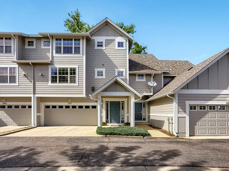 Front of townhouse, entry, garage and driveway