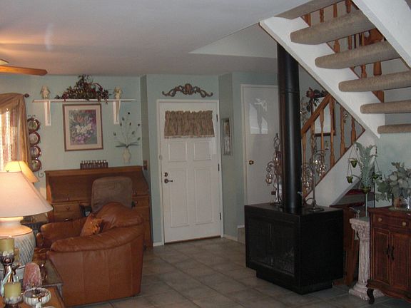 Front enterence with view of cozy woodstove