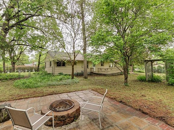 Private back yard with fire pit and deck.