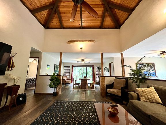 Living room, dining room, kitchen and seating area blend together in a great room concept.