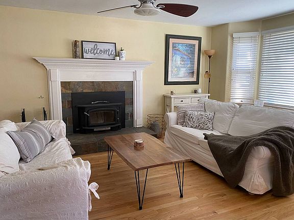 Living room and cozy wood burning fireplace