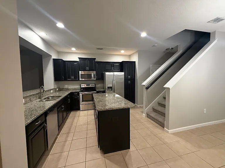 Large kitchen with an open floor plan.