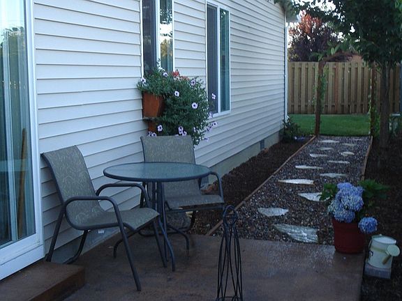 Patio and walkway leading to backyard