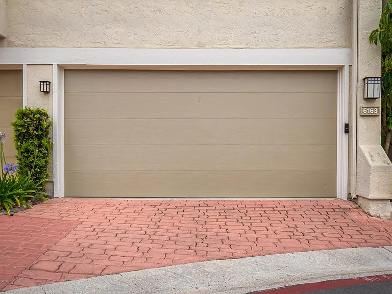 Spacious 2 car garage (detached) with additional storage closet
