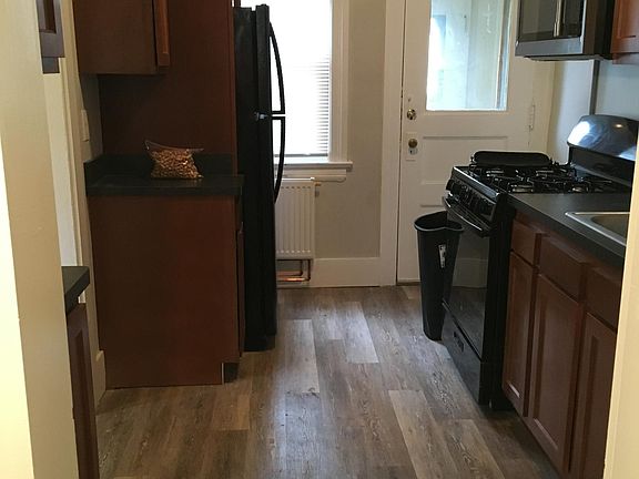 1172 Unit: Newly renovated galley kitchen with direct access to the backyard.