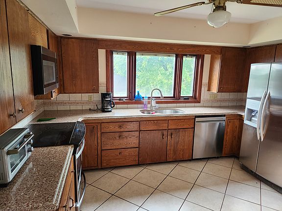 Kitchen, Glass stove top, custom sink,
dishwasher, side by side refrigerator.