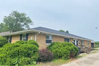 Front of brick duplex.