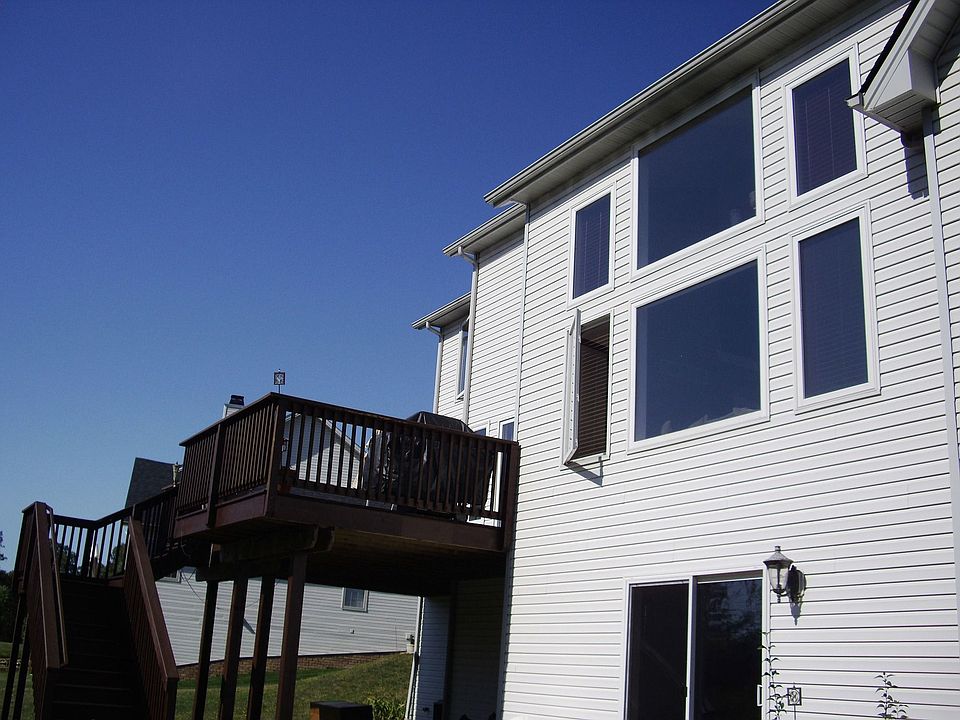 Rear exterior with views of pond & woods from every window in the rear. 