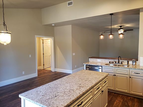 Kitchen looking to dining and living rooms