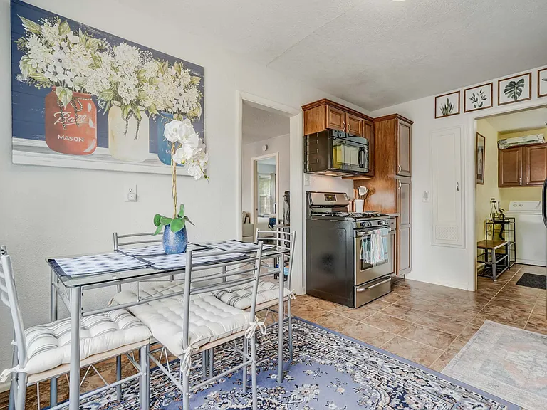 Fully stocked kitchen with seating for four