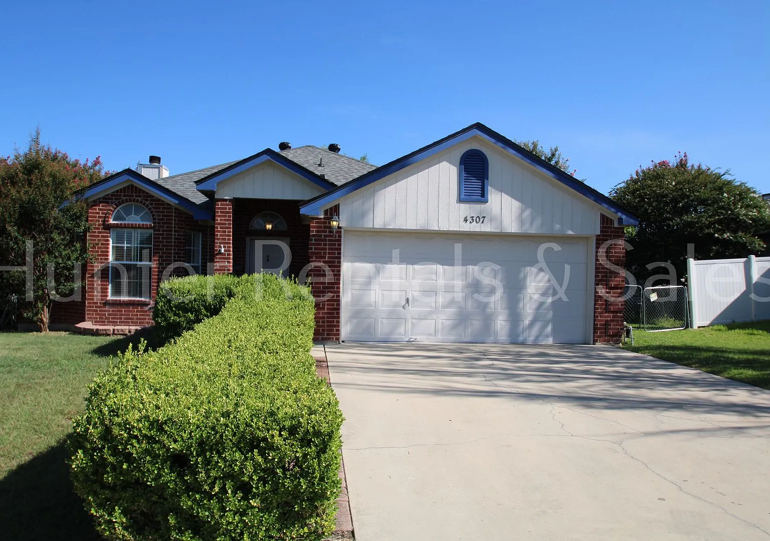 Exceptional Living with Vaulted Ceilings, Cozy Fireplace & Expansive Outdoor Space — Photo 1