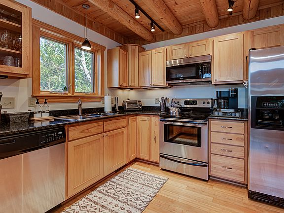 2nd floor, main level: Living room with queen-sized sleeper sofa, 55" Roku HDTV, full stocked kitchen with gas stove, dishwasher, full-sized refrigerator, breakfast nook, full bathroom.