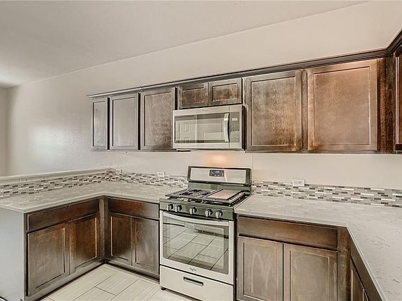 Great Kitchen with hardwood cabinets with plenty of storage and a pantry. all appliances are included! Fridge and dishwasher are here