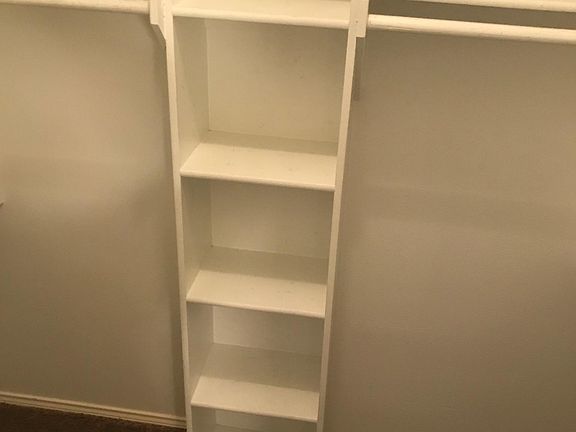 spacious closet w/built-in shelves