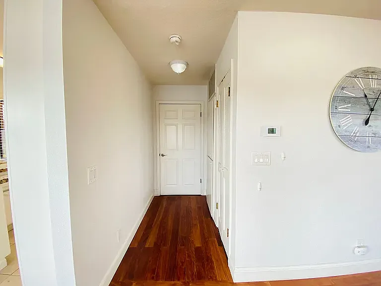 Private entry w/ linen closet + coat closet.