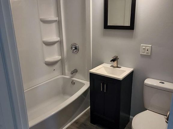 Bathroom with new water efficient toilet.