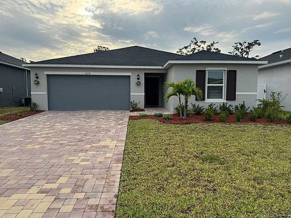 Pavers in the driveway, maintenance free landscaping