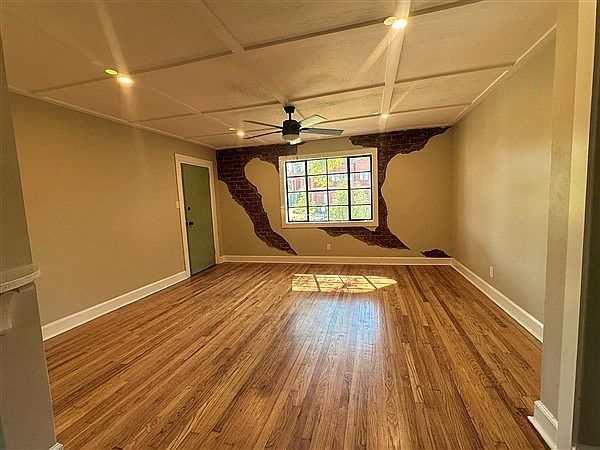 Huge Living Room with original Hardwood Floors.