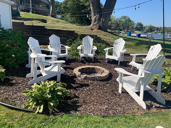 Fire pit and lights with 8 chairs.