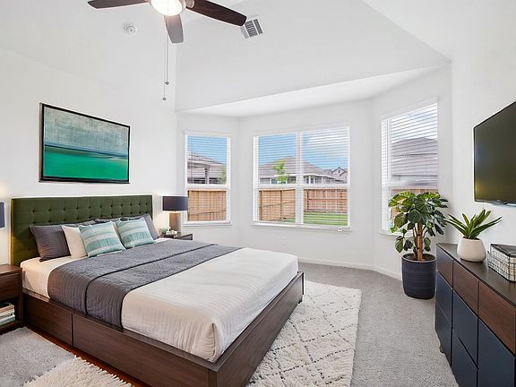 Virtually staged primary suite in the Pine floorplan at a Meritage Homes community.