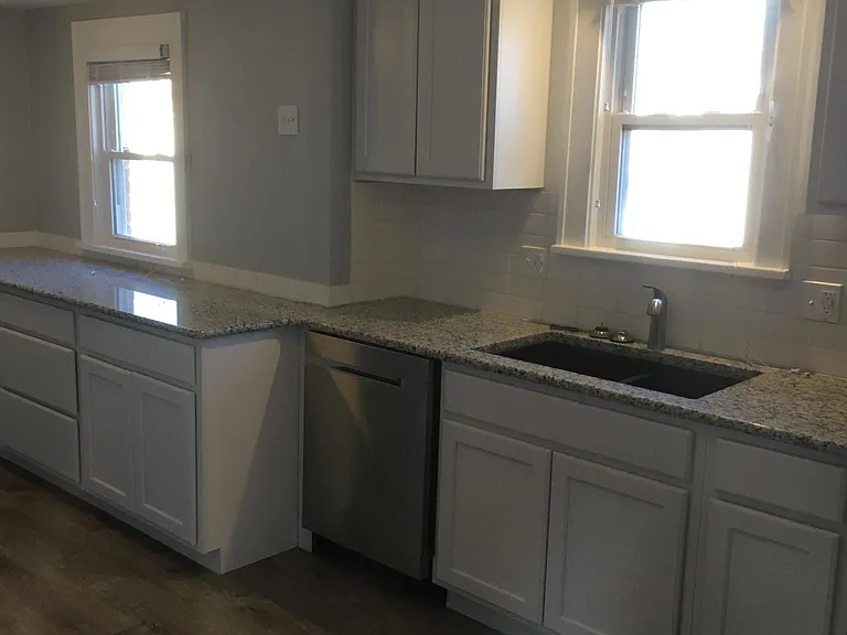 Custom cabinets including large pullout drawers for exceptional storage. New dishwasher and faucet in kitchen. (2026)