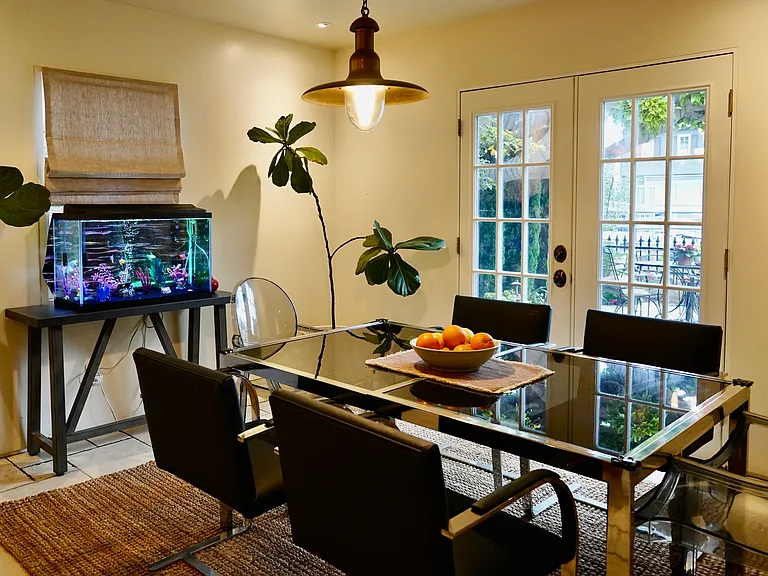 French doors open to front yard (fishtank not included)