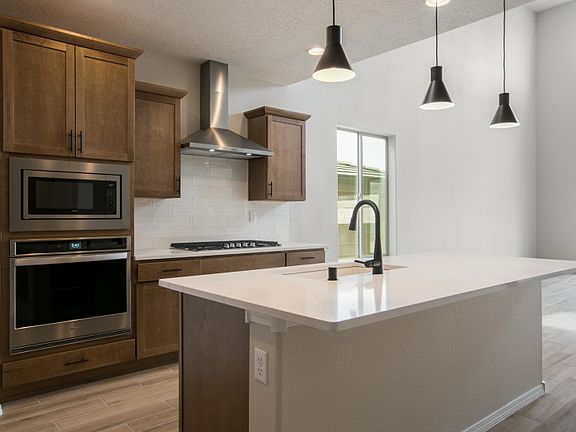 Enjoy your coffee each morning at the kitchen island with a built-in bar.