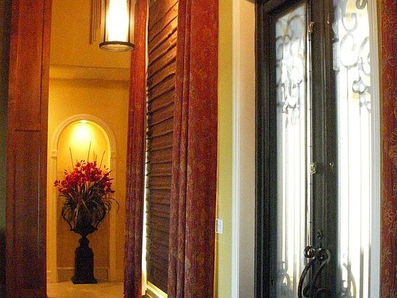 Wrought iron doors, marble entry