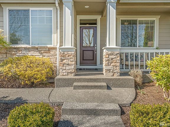 Inviting front entryway is well-lit and very oversized!  Its a nice place to set-up a small bistro table or a bench and relax while you listen to the happy sounds of the park and enjoy being outdoors all while under cover.