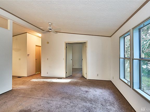 Living room looking towards the double doors, which is a 2nd bedroom.