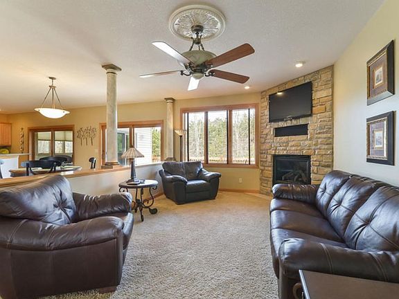 Main floor family room open to the kitchen.
Lots of built-ins, 2 gas fireplaces each with a fan for heat, and a  four season porch.