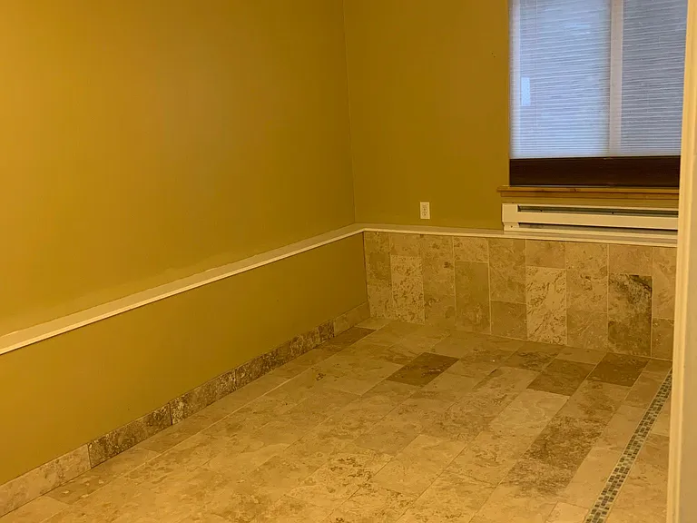 Additional downstairs bedroom with custom, hand laid radiant heat tile and insulated black out window shades (black out or sheer in all rooms)