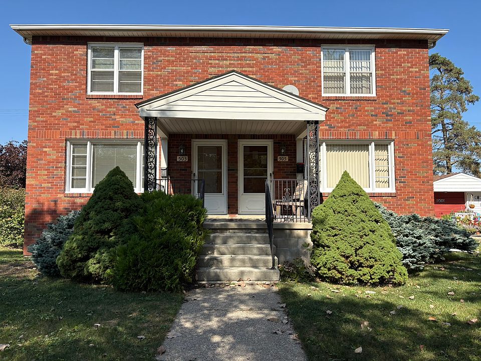 Brick duplex on corner lot near hospital.