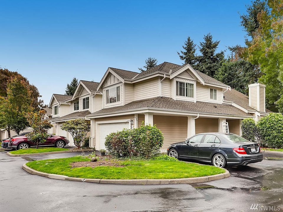 Beautiful end unit with a 2 car attached garage offers privacy and tranquility! Enjoy the small backyard,  additional parking space and lovely interior!