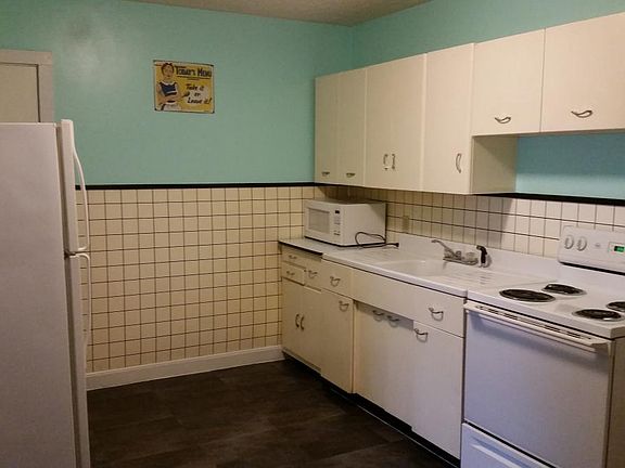 Kitchen is stocked with basic needs.