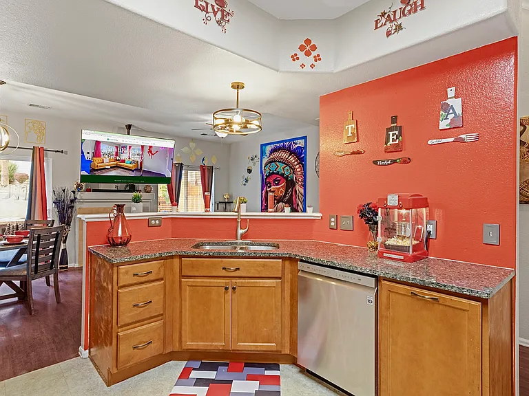 Spacious and well-equipped kitchen with modern appliances and plenty of counter space. Perfect for cooking up a feast or enjoying a quick meal.