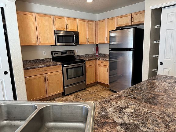 4th image of 18769 E 58th Ave Unit E