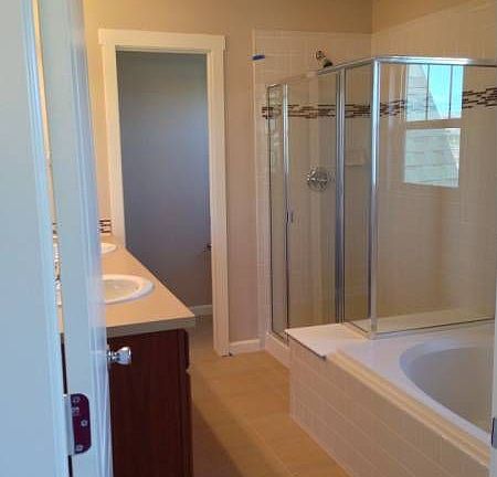 Master bath with tub and overs