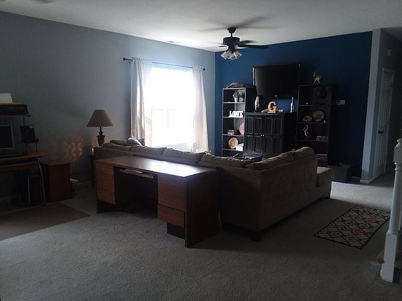 SPACIOUS LIVING ROOM ENTRY DOOR VIEW