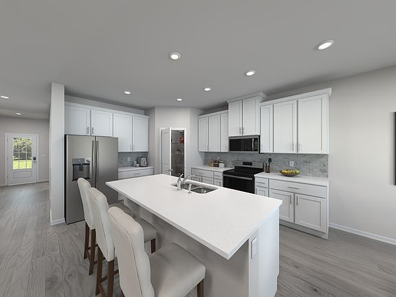 Prepare meals at the kitchen island while the kids hang out in the living area.