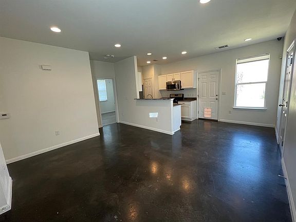 Classic concrete floors - open living/kitchen/dining concept.