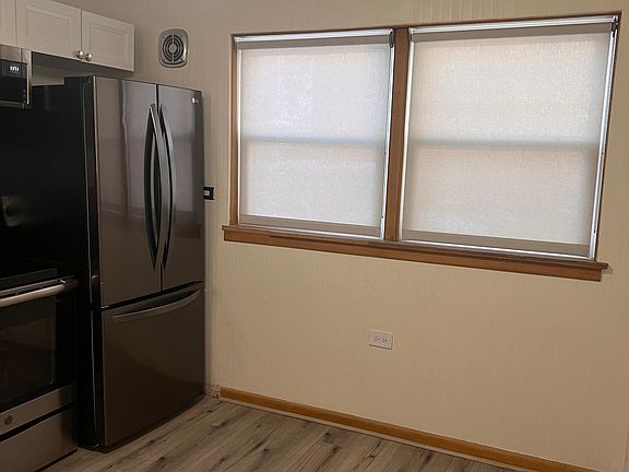 2 large kitchen windows that look out to the shared courtyard