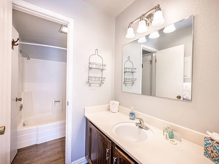 Master vanity with separate entrance to the tub/shower and toilet.
