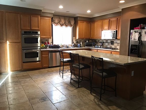 Kitchen with large island can be used for sitting area also