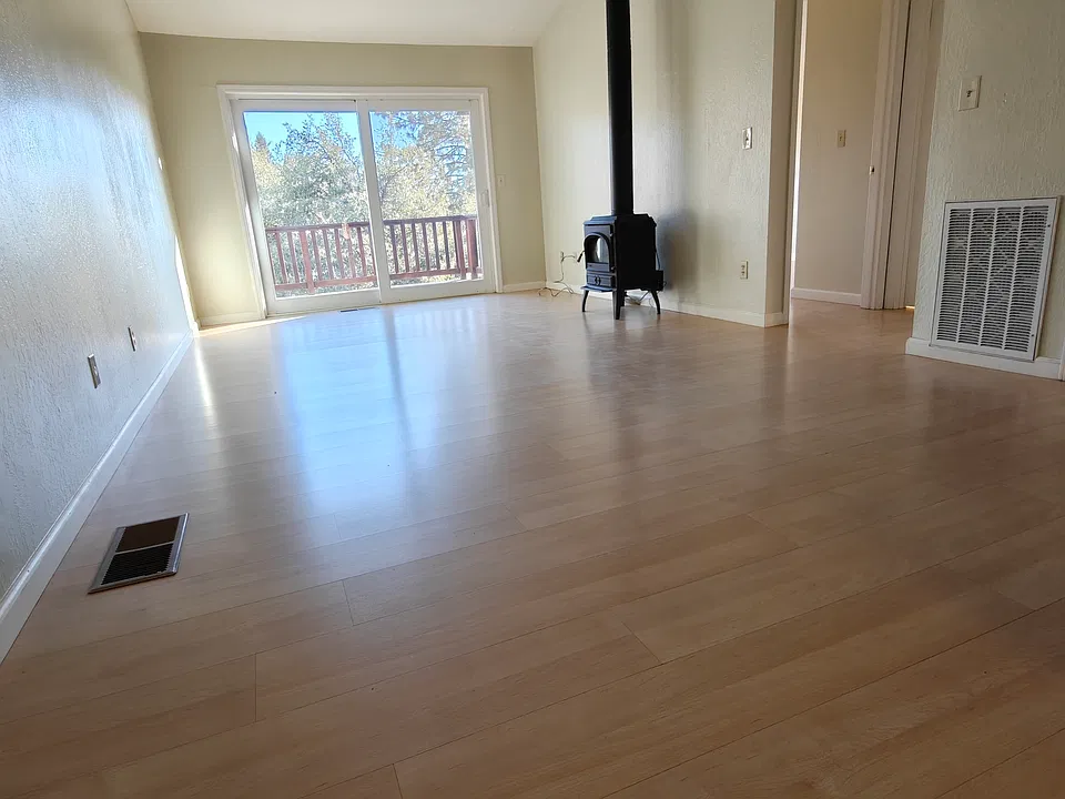 Open living room with propane stove.