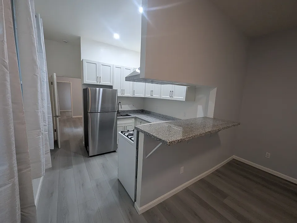 2026 remodel: all new kitchen and new floors throughout. This is a real photo. No AI in here- beautiful eh?