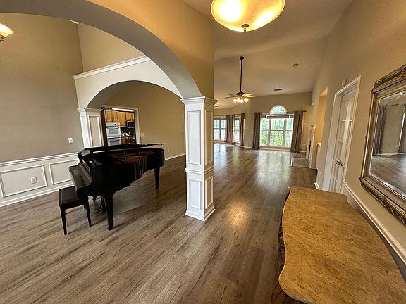 Foyer looking into living room and front sitting room