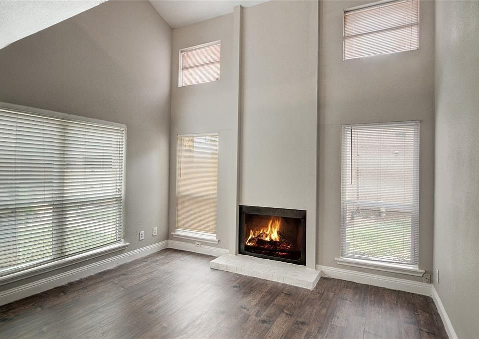 LIVING ROOM WITH WOOD BURNING FIREPLACE